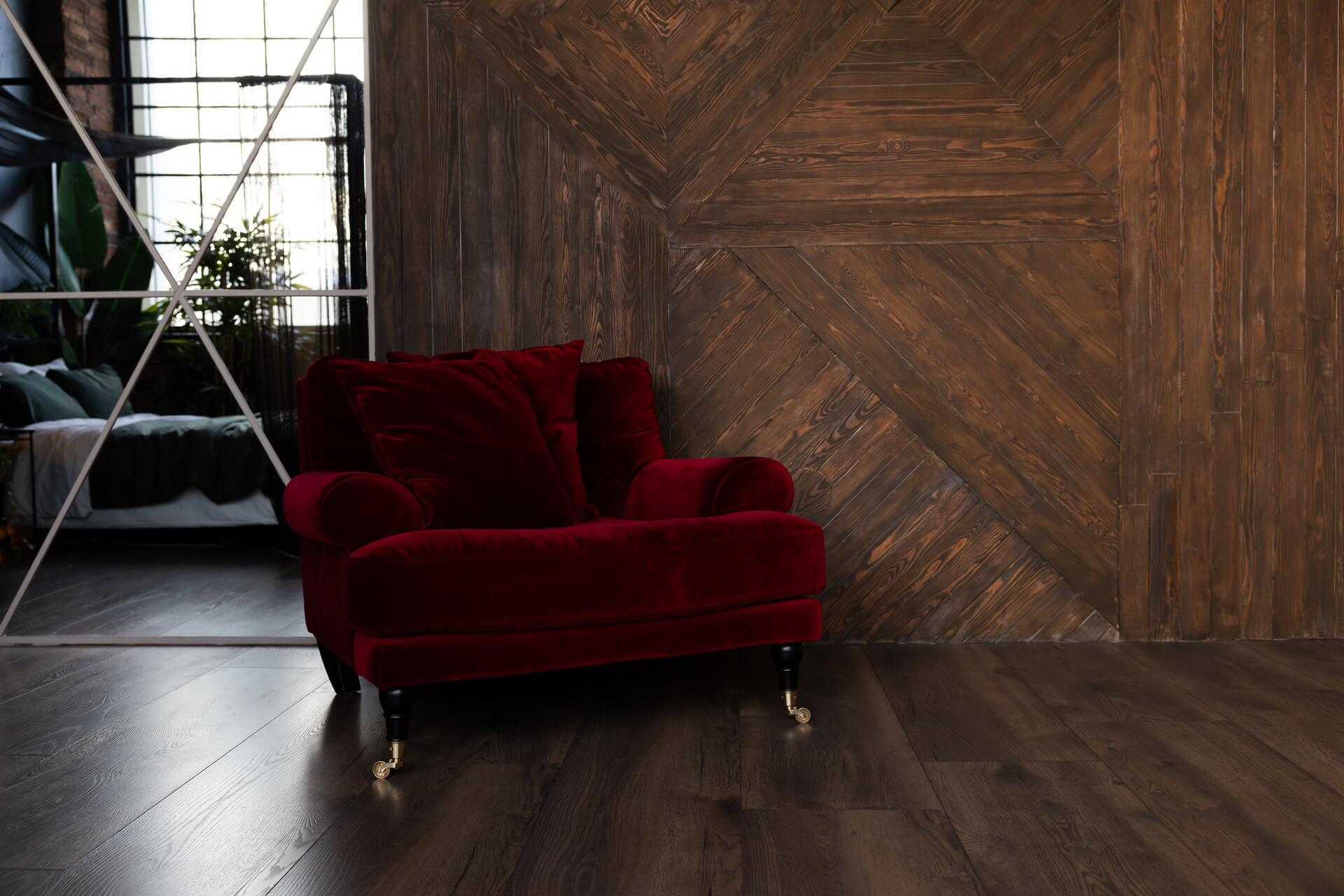 A high dark wall with panels made of wooden slats